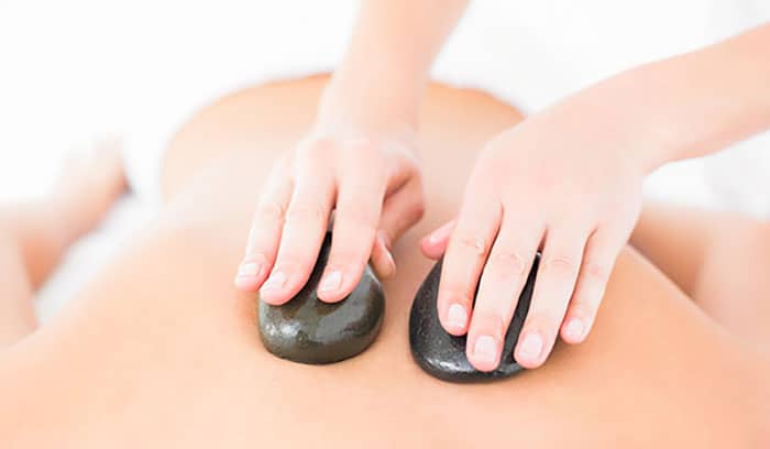 Man having hot stone massage